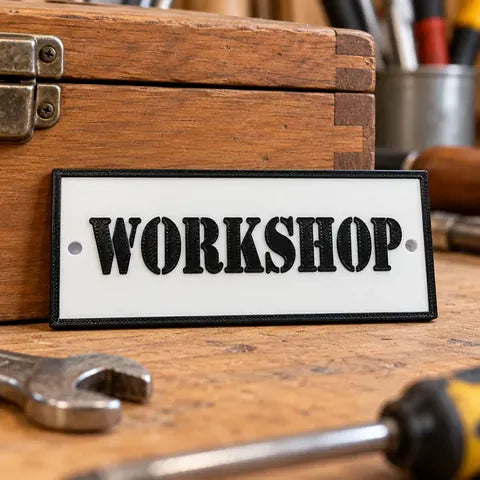 Black and white personalised 3D-printed Workshop plaque